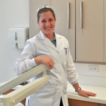 Dental Hygienist preparing room for routine dental cleaning in the office of Aesthetic & Implant Dentistry of Atlanta