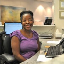 Dental Financing and Dental Insurance manager at Aesthetic & Implant Dentistry of Atlanta assisting patient with paperwork